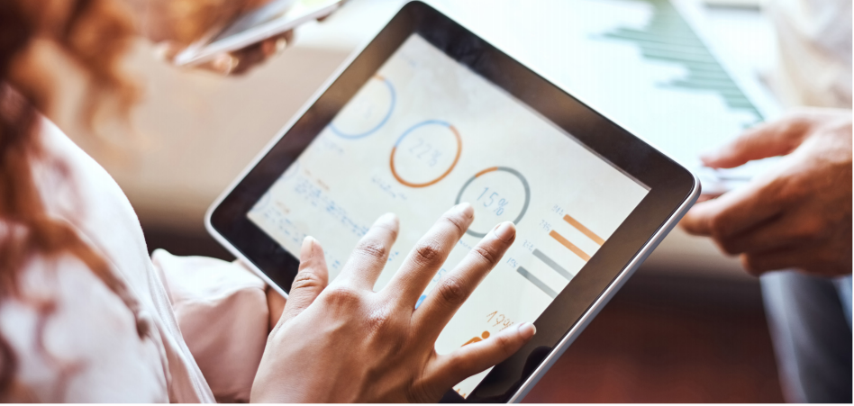 person showing charts on tracking value on a tablet screen